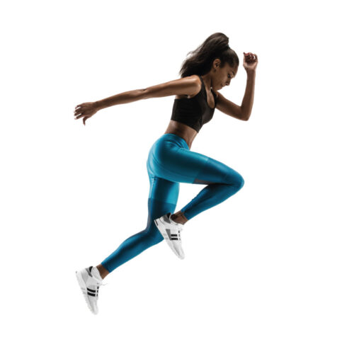 Young african woman running on white background | Aesthetics Beauty Boutique | Miami Florida