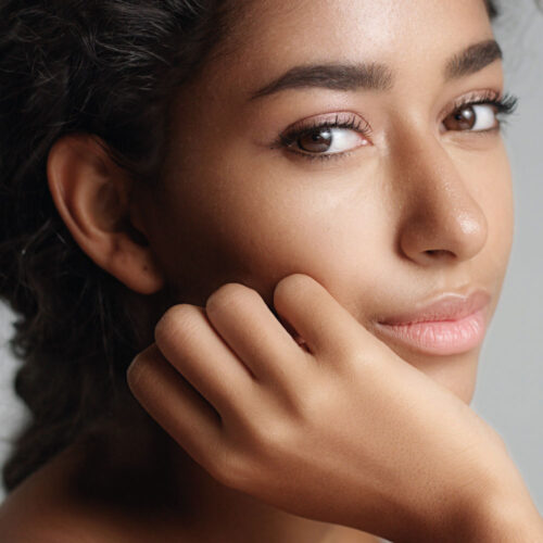 Happy young woman with beautiful olive skin | Aesthetics Beauty Boutique | Miami Florida